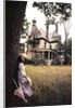 1960s 1970s Woman Standing Beside Tree Front Of Abandoned Haunted Victorian House by Anonymous