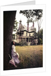 1960s 1970s Woman Standing Beside Tree Front Of Abandoned Haunted Victorian House by Anonymous