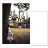 1960s 1970s Woman Standing Beside Tree Front Of Abandoned Haunted Victorian House by Anonymous