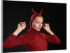 1960s Woman Red Devil Costume With Horns Arms Up In Air Looking Seductively At Camera by Anonymous