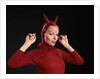 1960s Woman Red Devil Costume With Horns Arms Up In Air Looking Seductively At Camera by Anonymous
