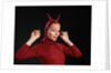 1960s Woman Red Devil Costume With Horns Arms Up In Air Looking Seductively At Camera by Anonymous