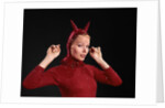 1960s Woman Red Devil Costume With Horns Arms Up In Air Looking Seductively At Camera by Anonymous