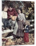 1950s Family Father Mother Son And Daughter Outdoor Carving A Pumpkin by Anonymous