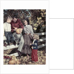 1950s Family Father Mother Son And Daughter Outdoor Carving A Pumpkin by Anonymous