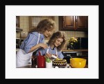 1970s Mother Daughter Dressed Alike Decorating Cake by Anonymous