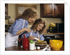 1970s Mother Daughter Dressed Alike Decorating Cake by Anonymous