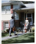 1950s Mother Daughter Waiting Steps House For Father Briefcase Coming Home Suburban Family Man Woman Girl Retro by Anonymous