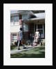 1950s Mother Daughter Waiting Steps House For Father Briefcase Coming Home Suburban Family Man Woman Girl Retro by Anonymous