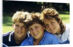1980s Two Brothers And Their Sister Posed Heads Together Smiling Looking At Camera by Anonymous