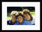 1980s Two Brothers And Their Sister Posed Heads Together Smiling Looking At Camera by Anonymous