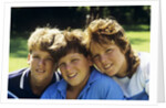 1980s Two Brothers And Their Sister Posed Heads Together Smiling Looking At Camera by Anonymous