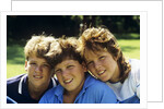 1980s Two Brothers And Their Sister Posed Heads Together Smiling Looking At Camera by Anonymous