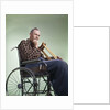 1960 1960s Retro Senior Man Sitting In Wheelchair With Crutches Blanket Wrapped Around Legs by Anonymous