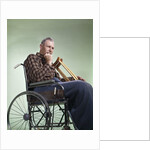 1960 1960s Retro Senior Man Sitting In Wheelchair With Crutches Blanket Wrapped Around Legs by Anonymous