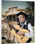 1960s Man Singing Cowboy Strumming Playing Acoustic Guitar by Anonymous