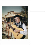 1960s Man Singing Cowboy Strumming Playing Acoustic Guitar by Anonymous