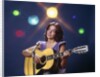 1970s Woman Girl Performer Playing Guitar Singing Microphone Stage Lights by Anonymous