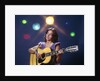 1970s Woman Girl Performer Playing Guitar Singing Microphone Stage Lights by Anonymous
