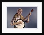 1960s Young Blonde Woman Wearing Plaid Shirt Playing Banjo Singing Folk Music Looking At Camera by Anonymous