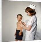 1960s Woman Nurse Give Injection Needle To Little Boy Arm Vaccine Vaccination Prevention Immunize Inoculate Medicine by Anonymous