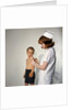 1960s Woman Nurse Give Injection Needle To Little Boy Arm Vaccine Vaccination Prevention Immunize Inoculate Medicine by Anonymous
