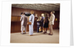 1970s Men Women Children Waiting In A Line In Bank For A Teller by Anonymous