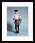 1970s Standing Full Length Portrait Of Middle Aged Mailman Carrying Mail Bag Wearing Uniform by Anonymous