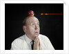 1960s Anxious Business Man Praying Looking Up At Arrow Heading Towards Apple Sitting On Top Of His Head by Anonymous