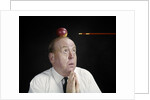 1960s Anxious Business Man Praying Looking Up At Arrow Heading Towards Apple Sitting On Top Of His Head by Anonymous