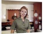 1960s Portrait Young Blonde Woman Housewife In Kitchen Smiling Looking At Camera by Anonymous