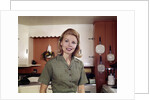 1960s Portrait Young Blonde Woman Housewife In Kitchen Smiling Looking At Camera by Anonymous