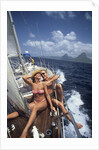 1990s Couple Sitting On Bow Of Sailboat Saint Lucia West Indies by Anonymous