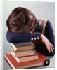 1960s 1970s Female Student Head Down On Pile Of Books Asleep Exhausted by Anonymous