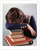 1960s 1970s Female Student Head Down On Pile Of Books Asleep Exhausted by Anonymous