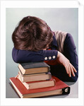 1960s 1970s Female Student Head Down On Pile Of Books Asleep Exhausted by Anonymous