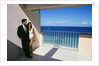 1990s Man In Dark Suit And Tie And Woman In White One Piece Bathing Suit Standing Together On Ocean Side Sun Deck by Anonymous