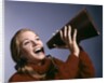 1960s Portrait Teen Cheerleader Girl Shouting Into Megaphone by Anonymous