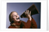 1960s Portrait Teen Cheerleader Girl Shouting Into Megaphone by Anonymous