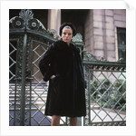 1960s Young Woman Wearing Dark Mink Coat Hat Standing Ornate Wrought Iron Gate Fur Retro by Anonymous