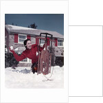 1950s Woman Hiding Behind Sled Throwing Snowball Front Stone House by Anonymous