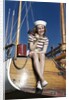 1940s Smiling Woman Wearing Nautical Sailor Outfit And Hat Sitting On Edge Of Boat Holding Paint Brush by Anonymous