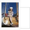 1940s Smiling Woman Wearing Nautical Sailor Outfit And Hat Sitting On Edge Of Boat Holding Paint Brush by Anonymous