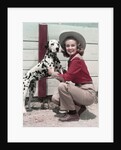1940s 1950s Smiling Woman Wearing Western Cowgirl Outfit Kneeling Petting Dalmatian Dog by Anonymous