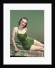 1940s Portrait Smiling Woman Wearing Green Velvet Bathing Suit Sitting Posing On Diving Board by Anonymous