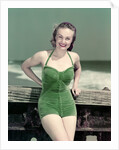 1940s Portrait Smiling Woman Wearing Green Velvet Bathing Suit Posing Leaning On Diving Board by Anonymous