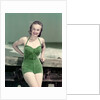 1940s Portrait Smiling Woman Wearing Green Velvet Bathing Suit Posing Leaning On Diving Board by Anonymous