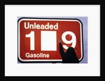 1980s Anonymous Unidentified Person Changing Gasoline Prices Sign by Anonymous