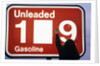 1980s Anonymous Unidentified Person Changing Gasoline Prices Sign by Anonymous
