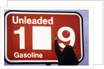 1980s Anonymous Unidentified Person Changing Gasoline Prices Sign by Anonymous